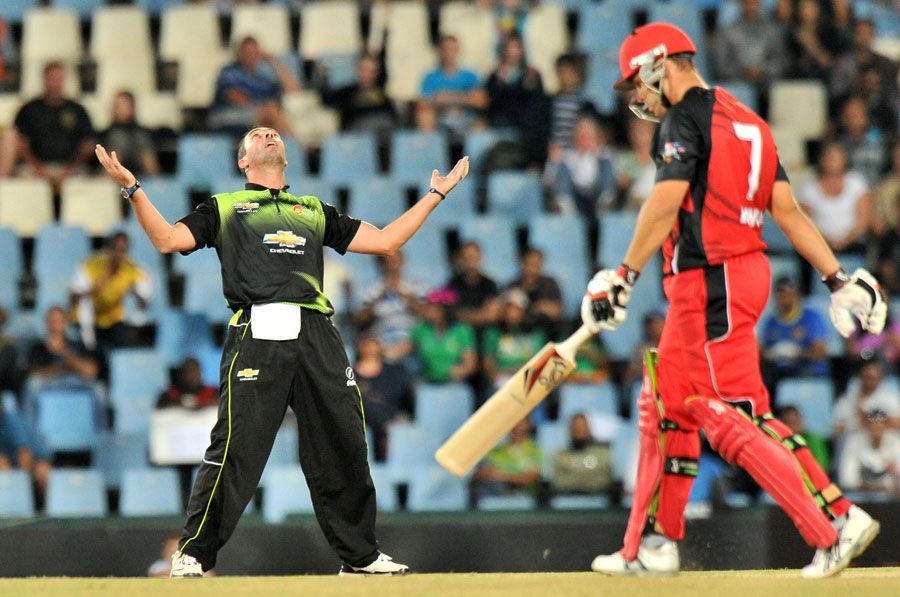 Nicky Boje celebrates after catching Graham Manou off his own bowling