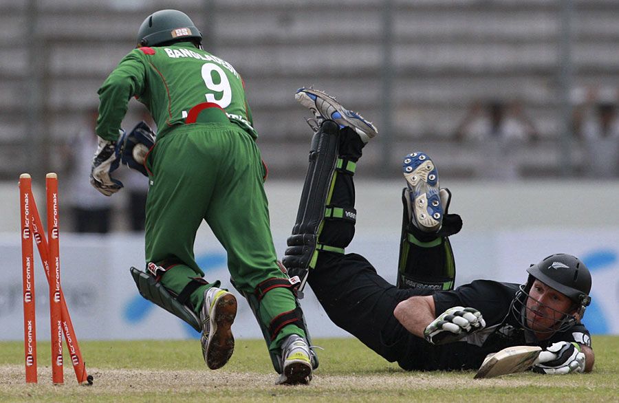 Mushfiqur Rahim celebrates after running Shanan Stewart out