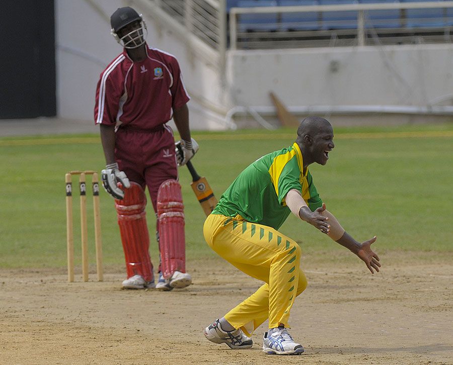 Darren Sammy dismisses Gavin Williams, one of his four victims, for a duck