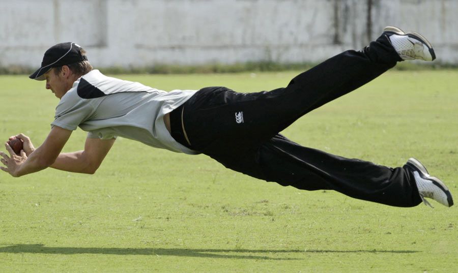 New Zealand's Brent Arnel takes a diving catch
