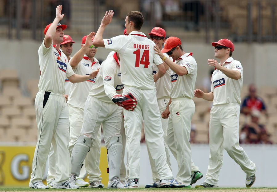 Peter George celebrates a wicket