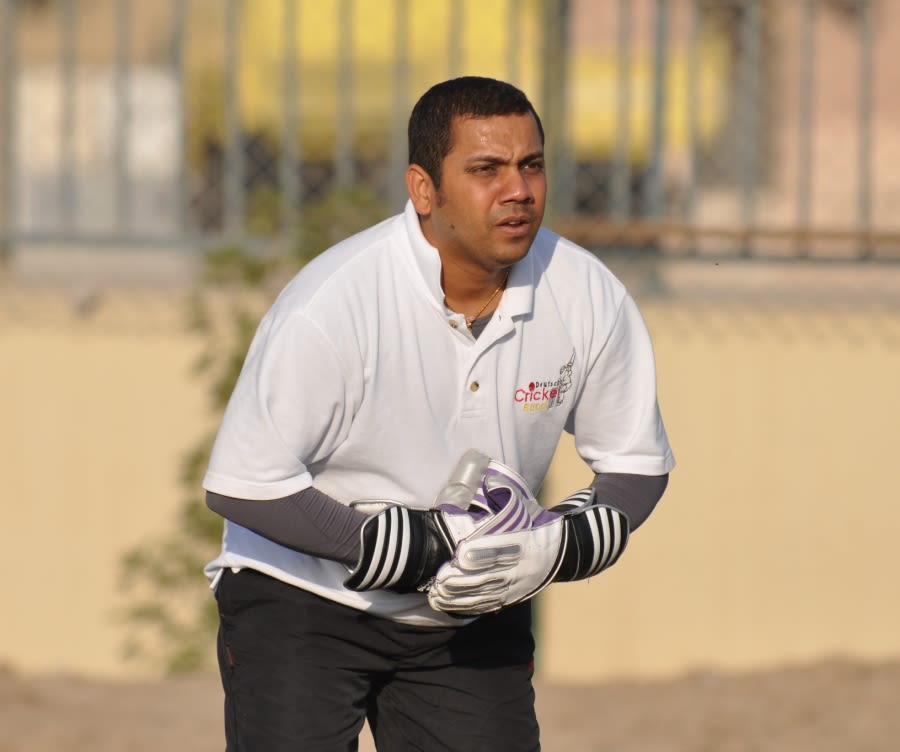 Srinivas Satyanarayana, Germany's wicketkeeper, warms up before his team's semi-final