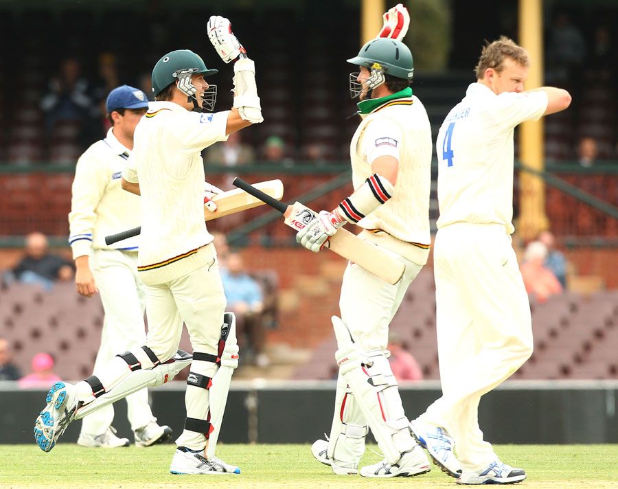 Luke Butterworth and Adam Maher celebrate their win in front of Doug Bollinger