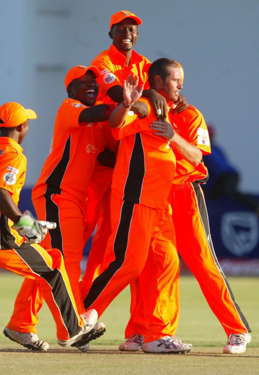 Andrew Hall is congratulated by his team-mates after a nerveless final over