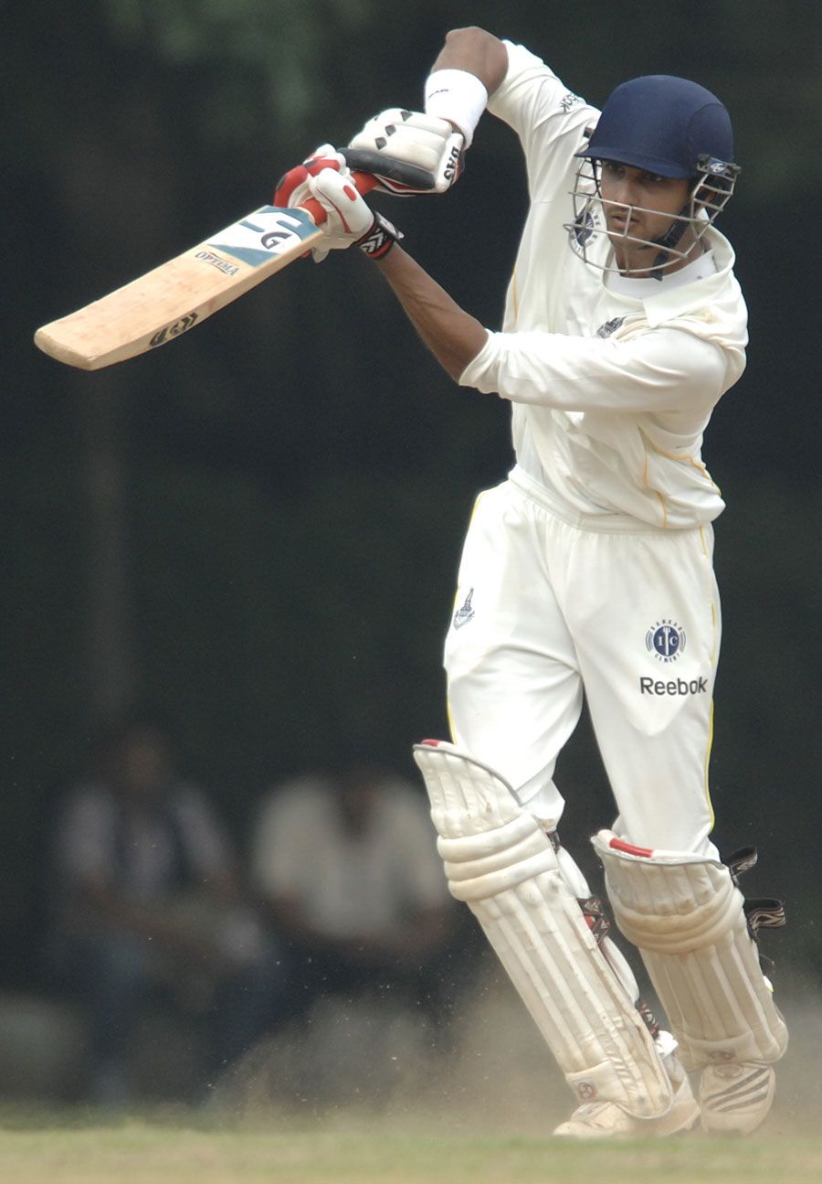 K Vasudevadas punches one through the off side during his 99