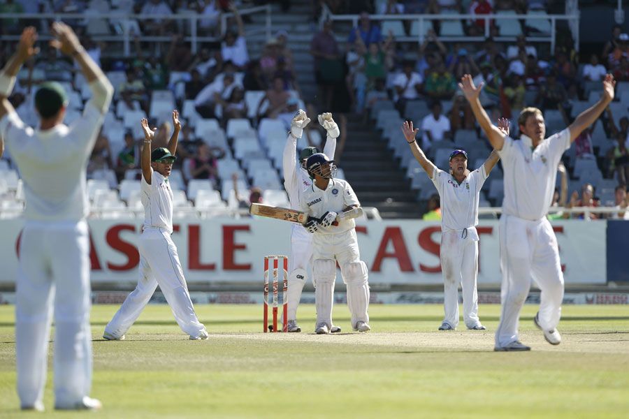 Sachin Tendulkar is surrounded by fielders towards the end of the fifth day