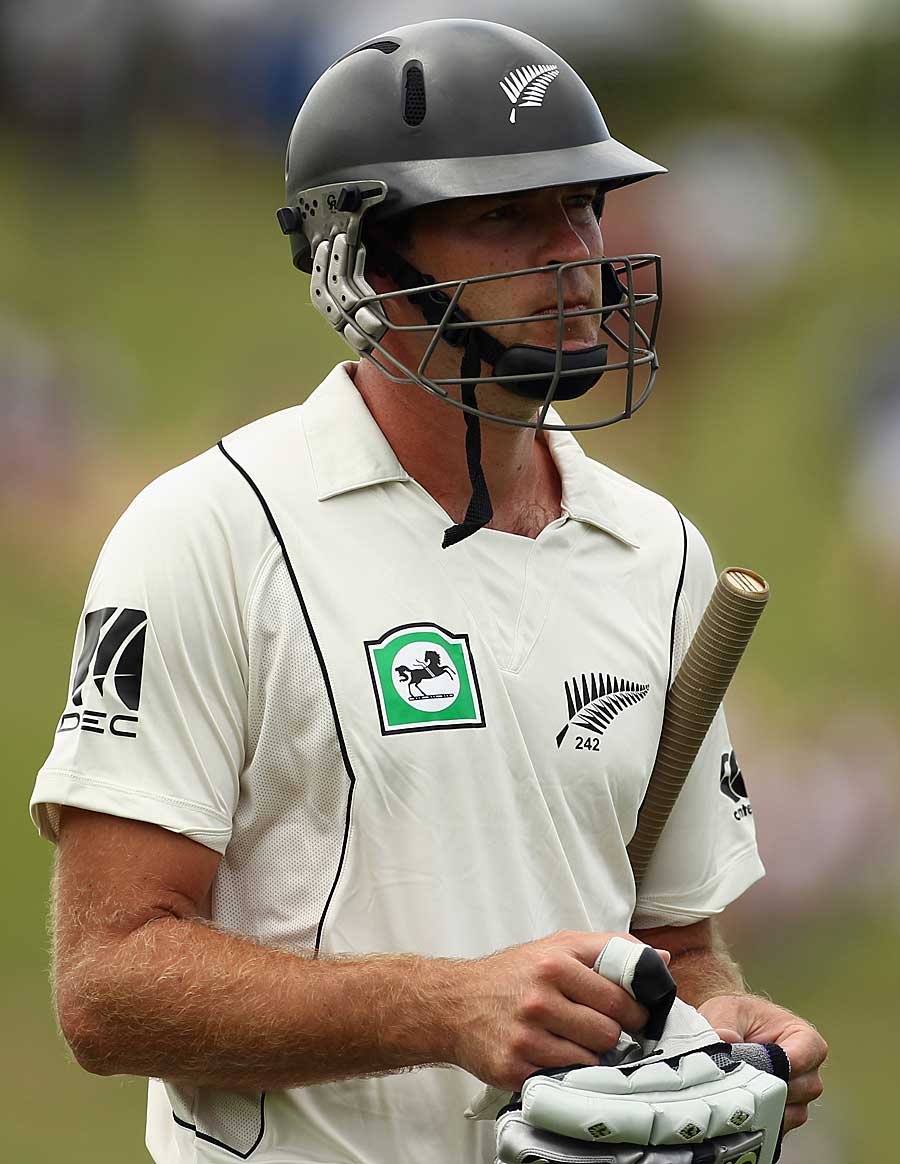 Tim McIntosh walks back after being dismissed