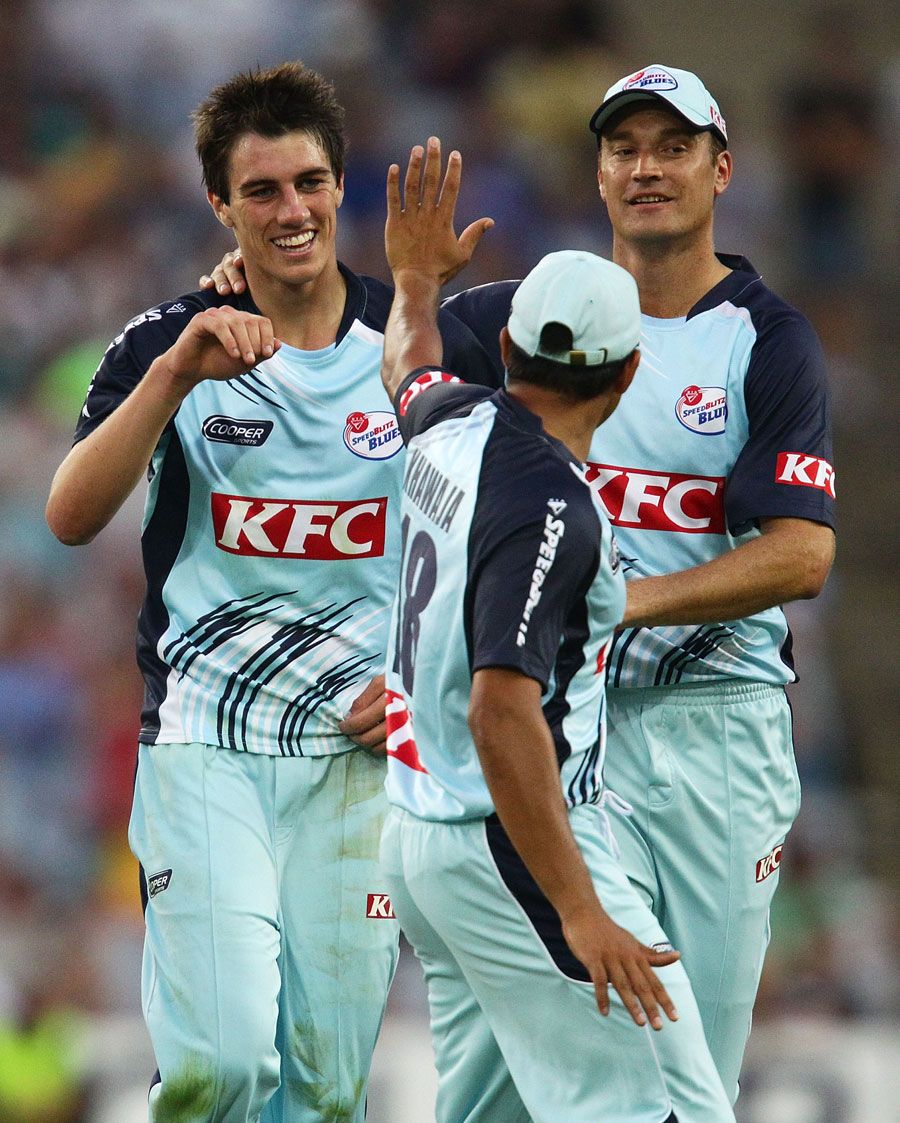 Patrick Cummins is congratulated on getting the wicket of Travis Birt