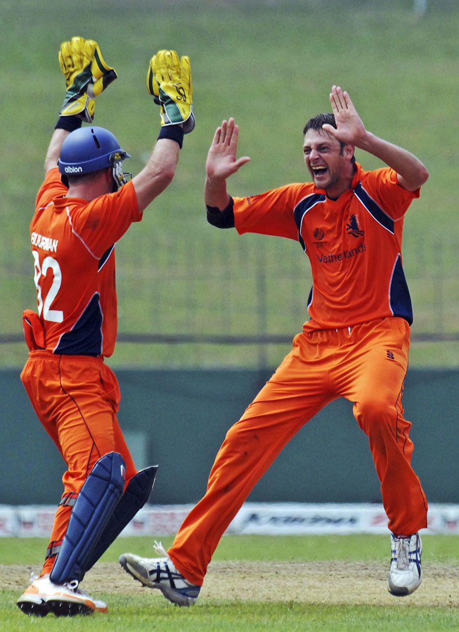 Atse Buurman and Bernard Loots celebrate the wicket of David Obuya