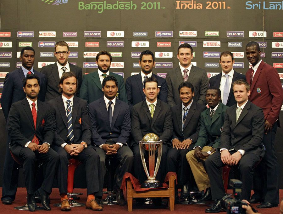 The captains of the participating nations pose with the World Cup trophy