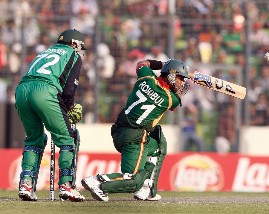 Raqibul Hasan drives through the covers during his innings of 38