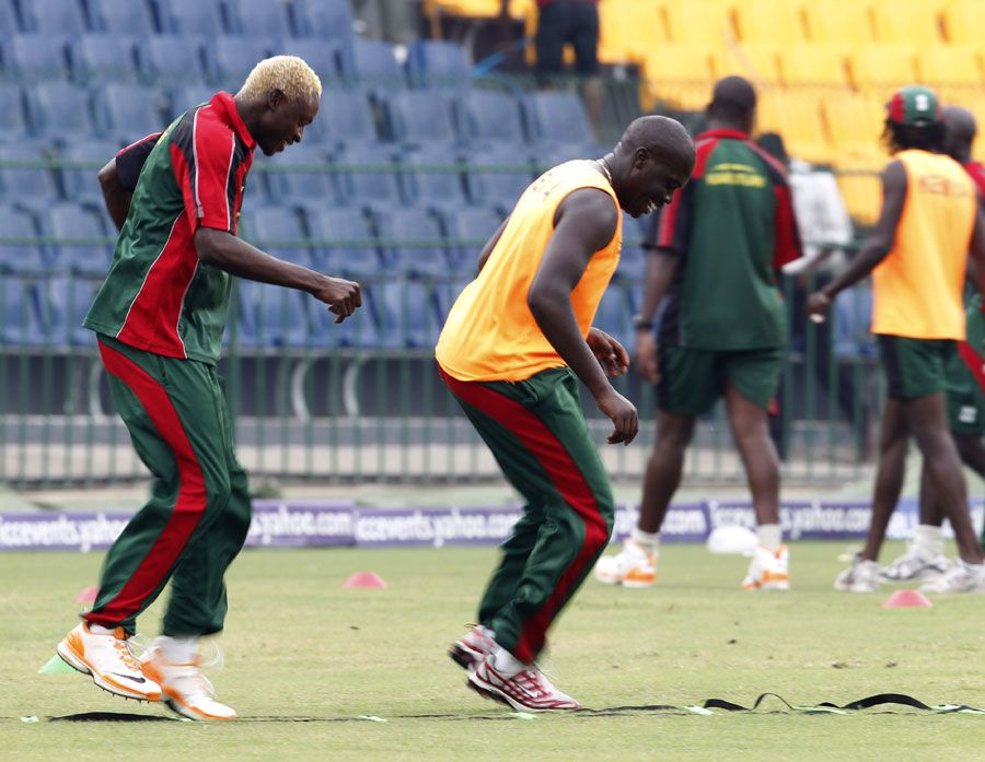 Elijah Otieno and David Obuya warm up during Kenya's training session