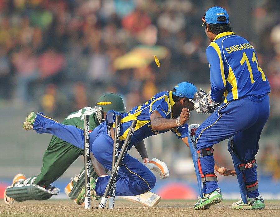 Chamara Silva completes the run out of Jimmy Kamande