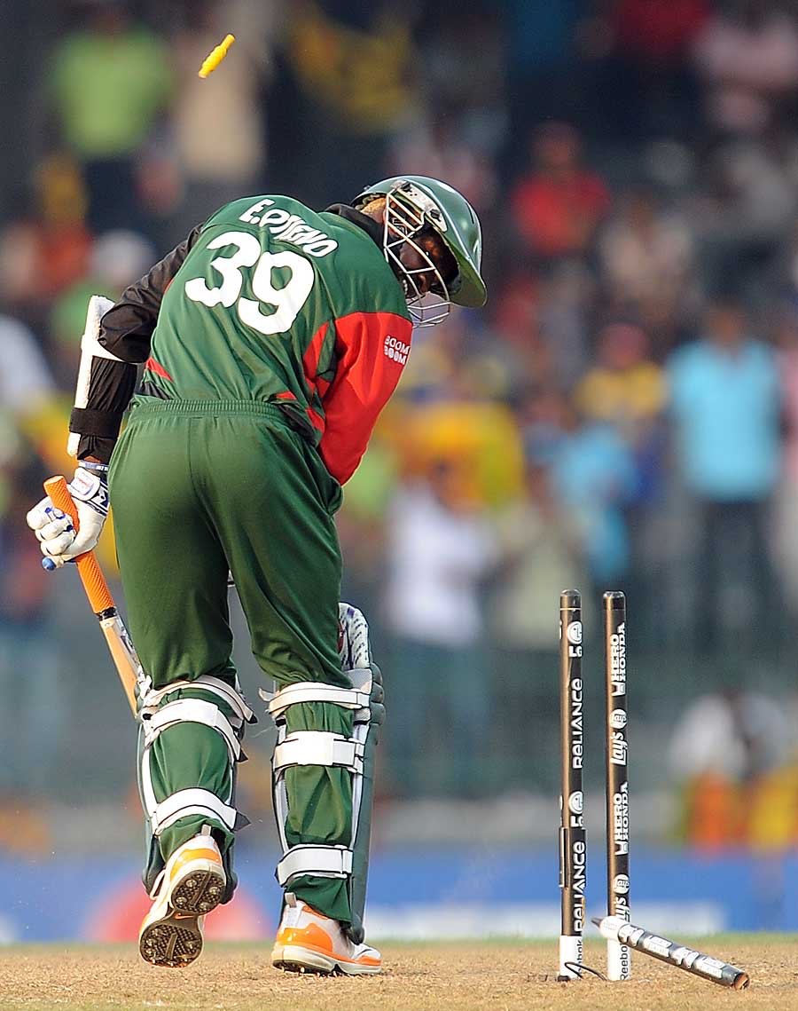 Elijah Otieno watches his stump get uprooted