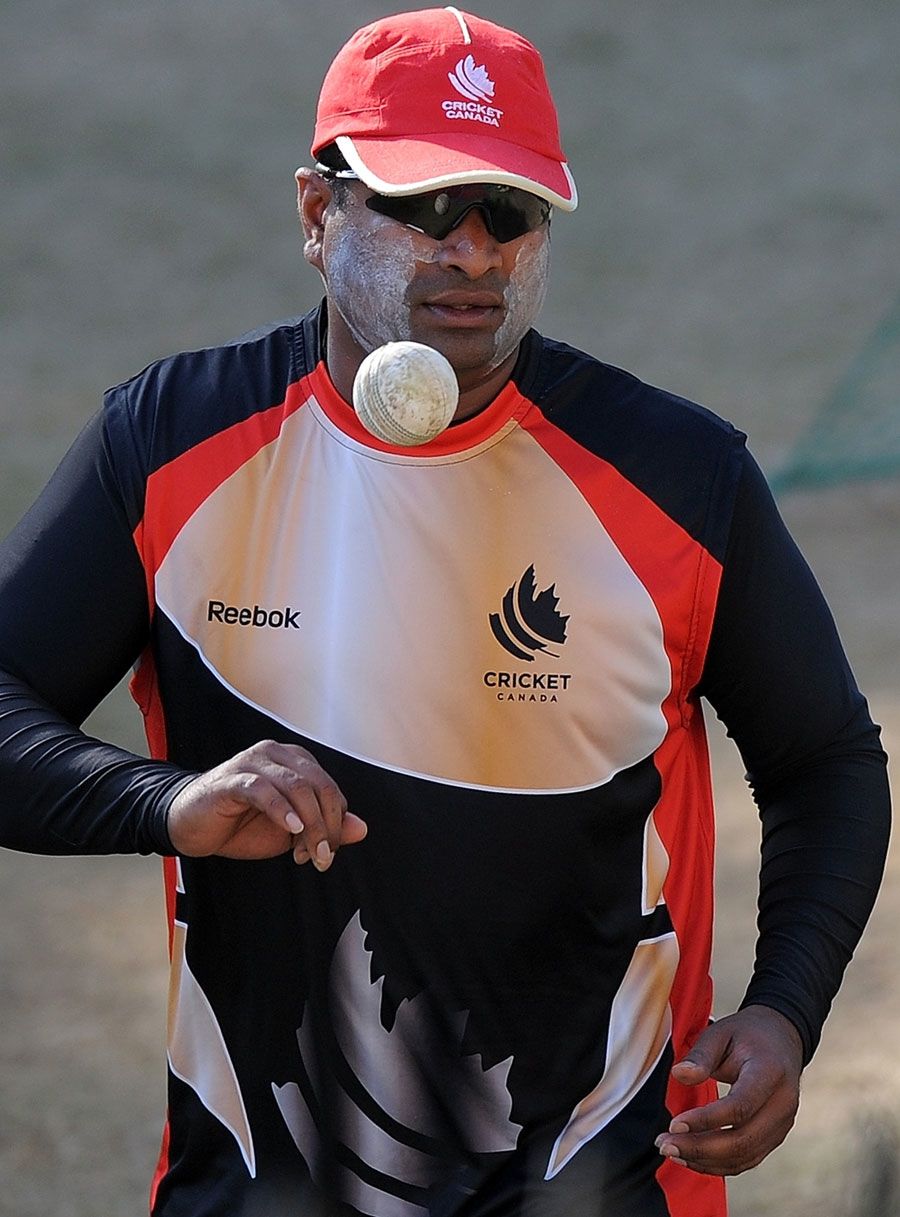 Balaji Rao prepares to bowl during practice