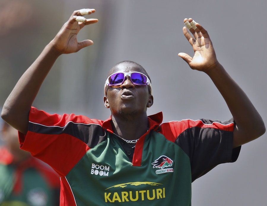 Kenya's James Ngoche reacts after bowling in the nets