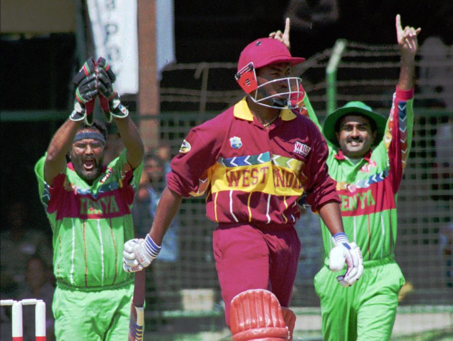 Wicketkeeper Tariq Iqbal and  Aasif Karim celebrate as Brian Lara is caught behind 