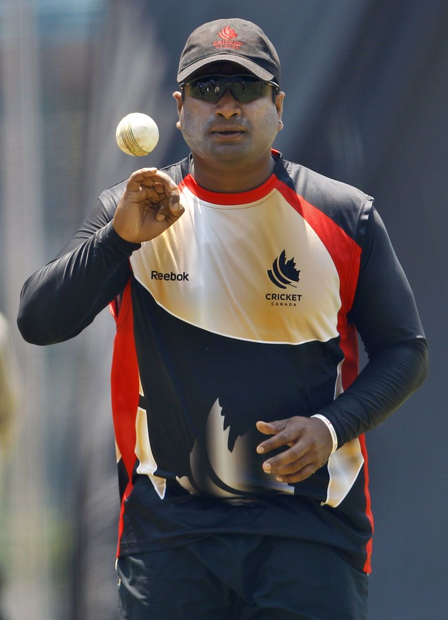 Balaji Rao gets ready to bowl during Canada's training session