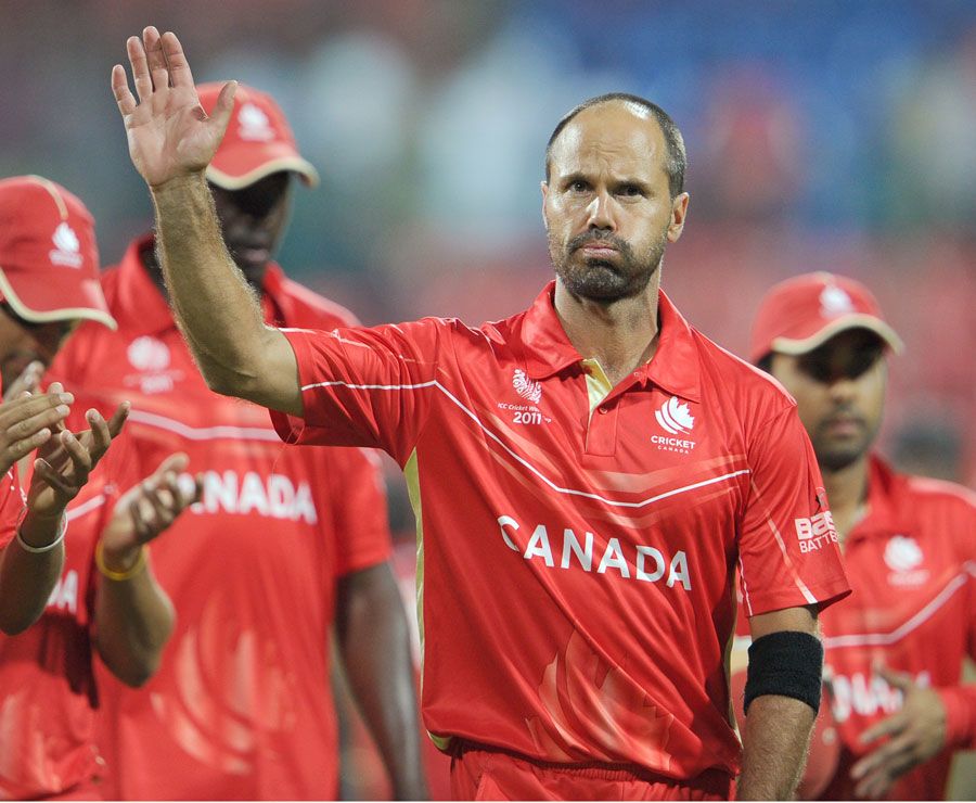 John Davison waves to the fans as he walks off the field after his last game for Canada