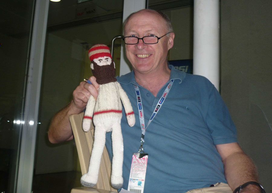 Vic Marks poses with a doll of WG Grace