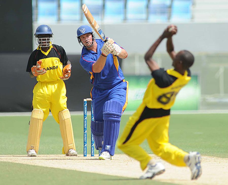 Deusdedit Muhumuza takes a sharp catch off his own bowling to dismiss Jan-Berrie Burger