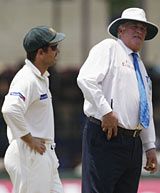 Justin Langer of Australia and umpire David Orchard 