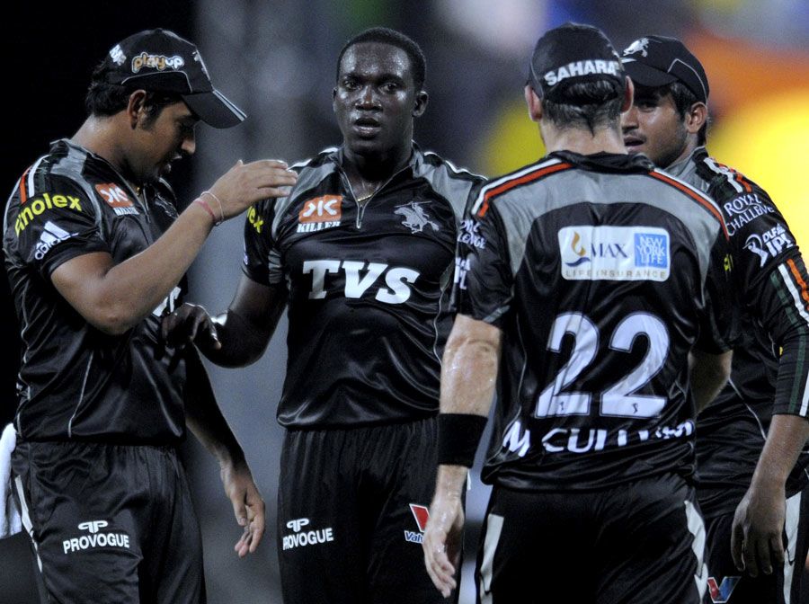 Jerome Taylor is congratulated after getting Michael Hussey