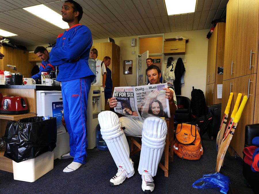 Leicestershire's Jacques du Toit reads about the Royal Wedding while waiting to bat against Derbyshire at Grace Road