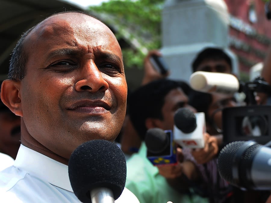 Hashan Tillakaratne speaks to reporters in Colombo