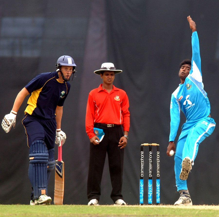 Alauddin Babu runs in to bowl