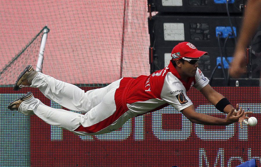 Paul Valthaty unsuccessfully attempts to hold a catch