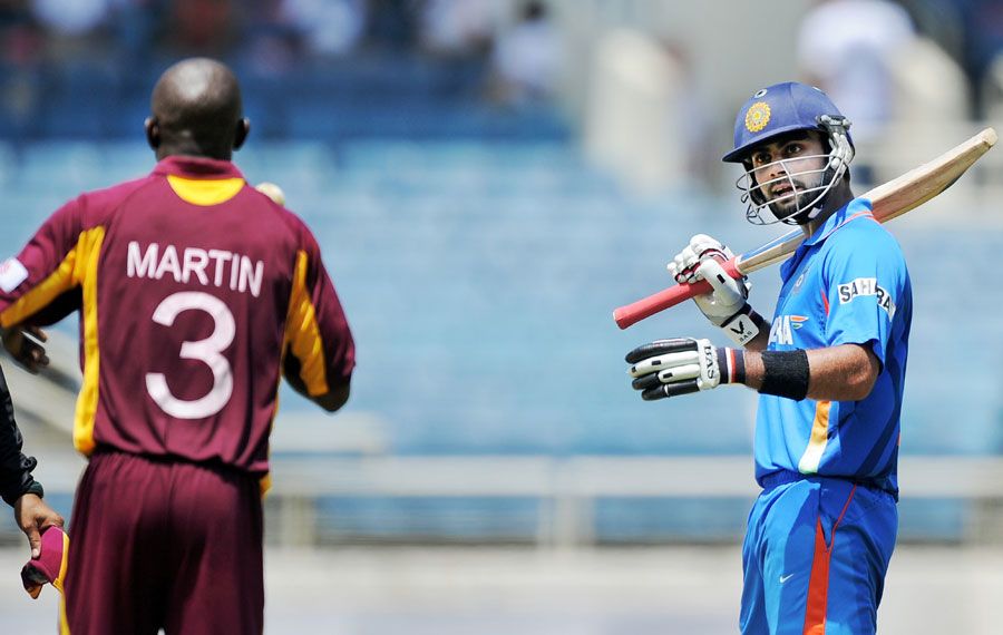 Anthony Martin and Virat Kohli exchange a few words