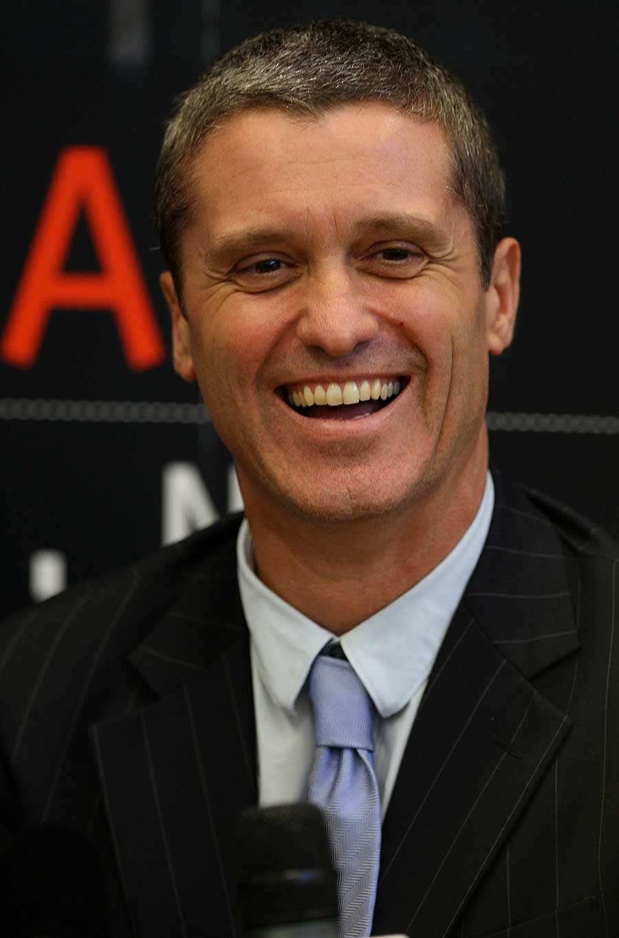 New Zealand Cricket CEO Justin Vaughan is all smiles at a press conference