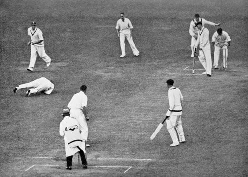 Patsy Hendren dives to catch Tim Wall off Hedley Verity