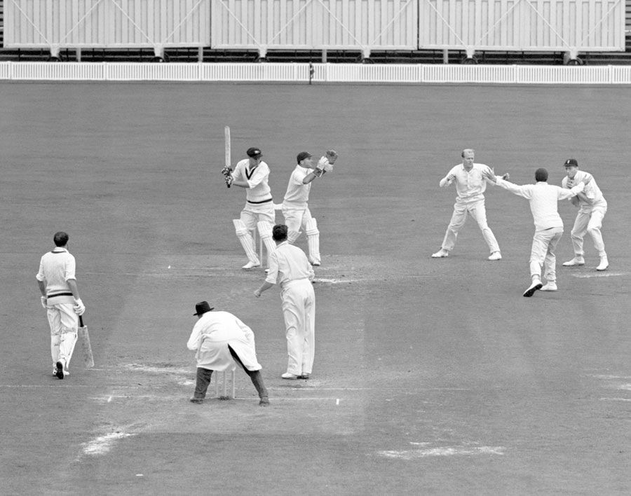 Ron Archer is caught by Alan Oakman off Jim Laker for a duck