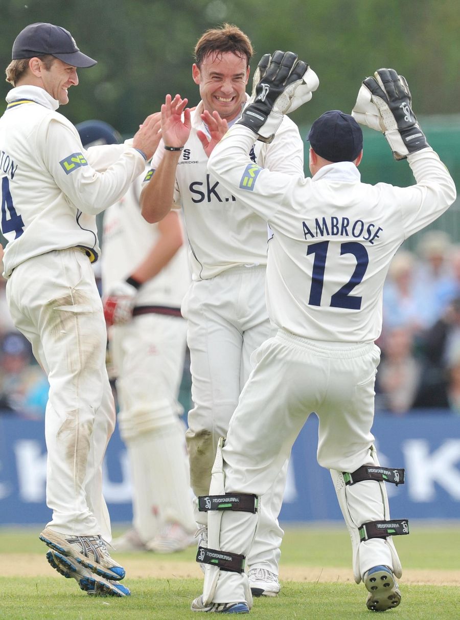 Neil Carter is congratulated on another Lancashire wicket