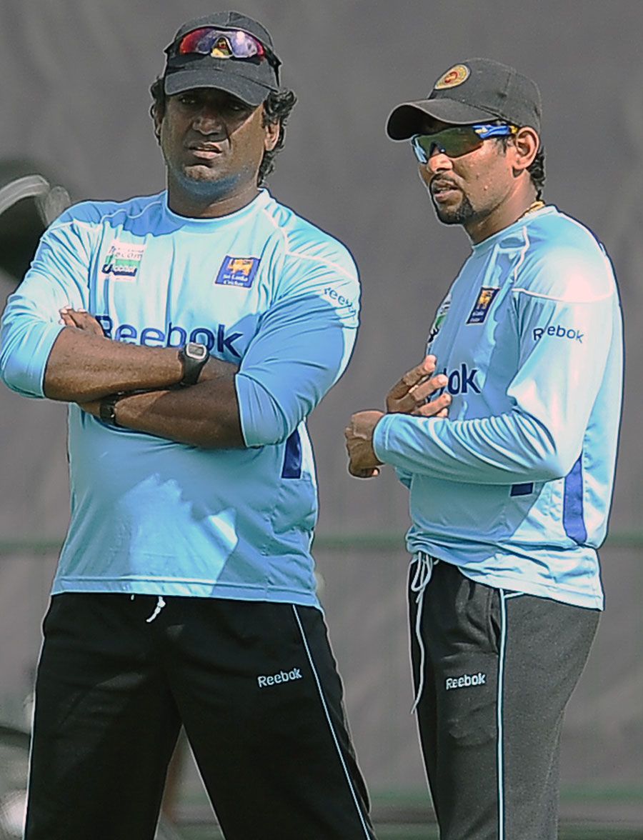 Rumesh Ratnayake and Tillakaratne Dilshan talk during a practice session 