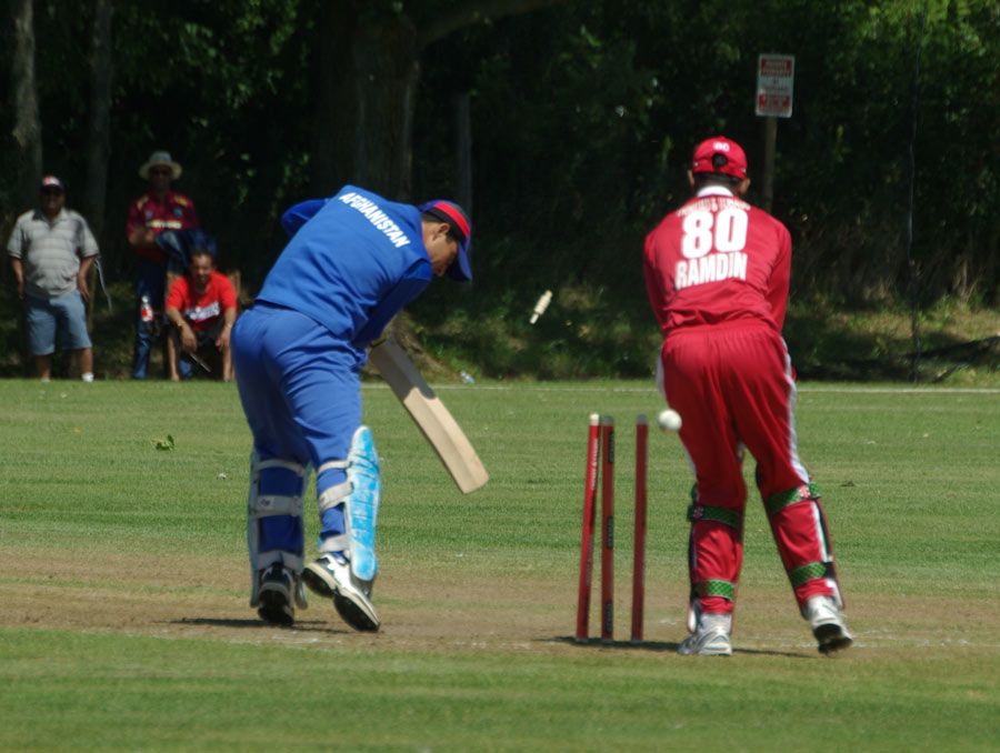 Sherwin Ganga completes his hat-trick by bowling Afghanistan's Amir Hamza