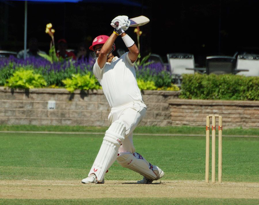 Jimmy Hansra hammers a six on his way to his century