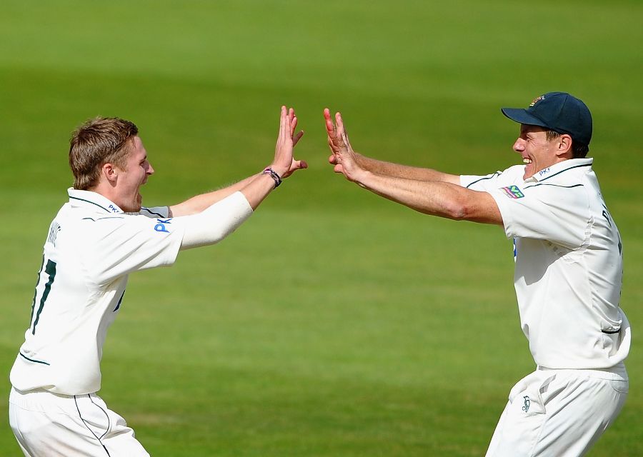 Graeme White and Darren Pattinson celebrate the fall of a Durham wicket