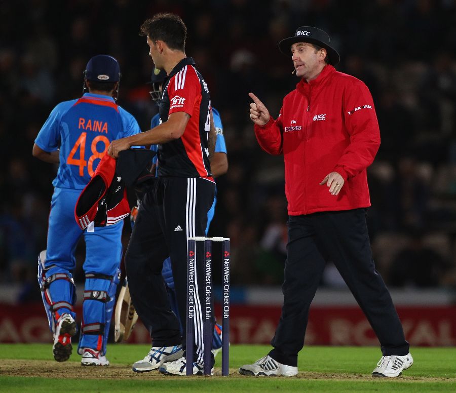 Jade Dernbach is reprimanded by umpire Rob Bailey after a spat with Suresh Raina