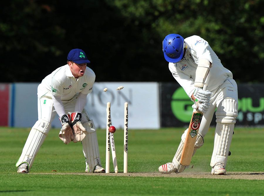 Gerrie Snyman is bowled by George Dockrell for 25