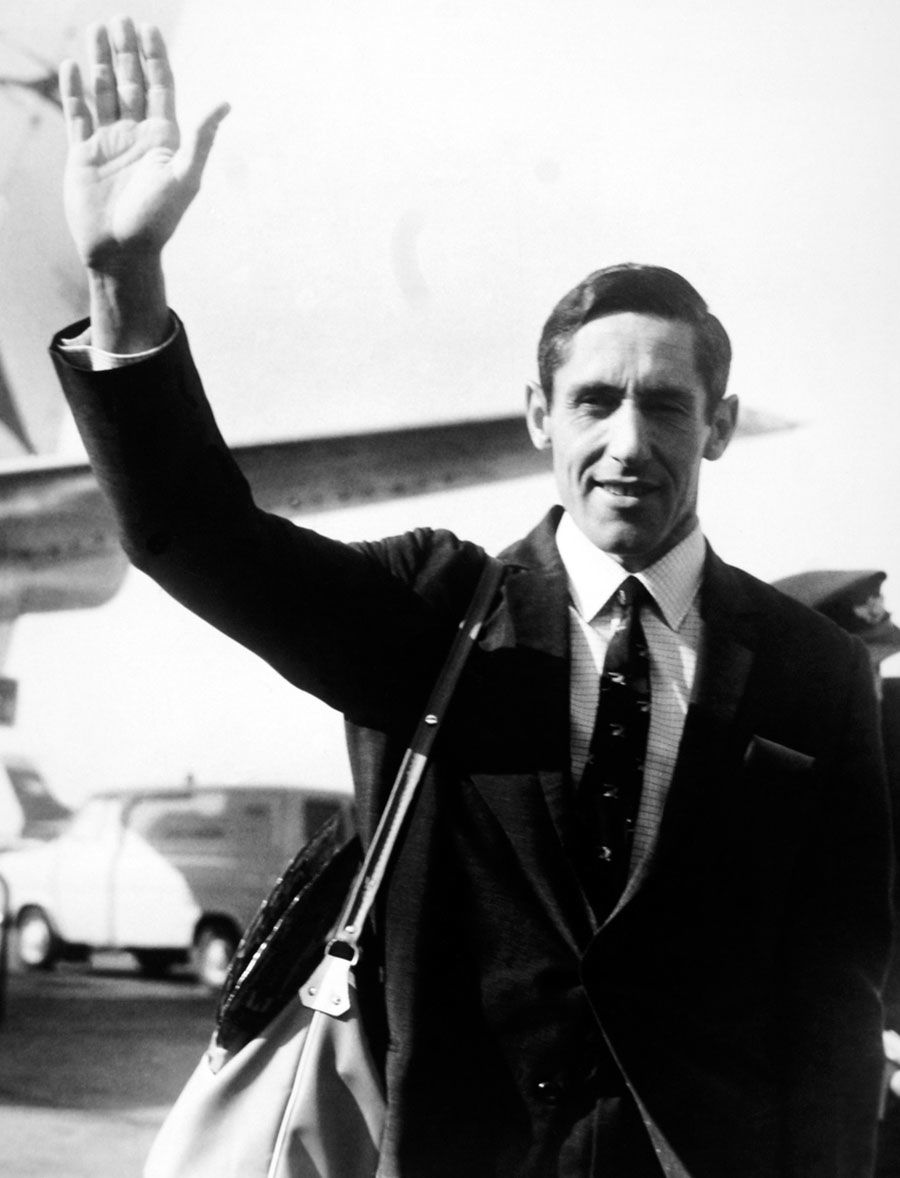 New Zealand captain Graham Dowling waves after landing in London