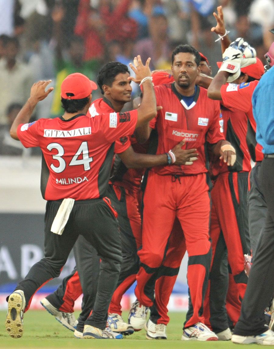 Janaka Gunaratne is congratulated on dismissing Lendl Simmons