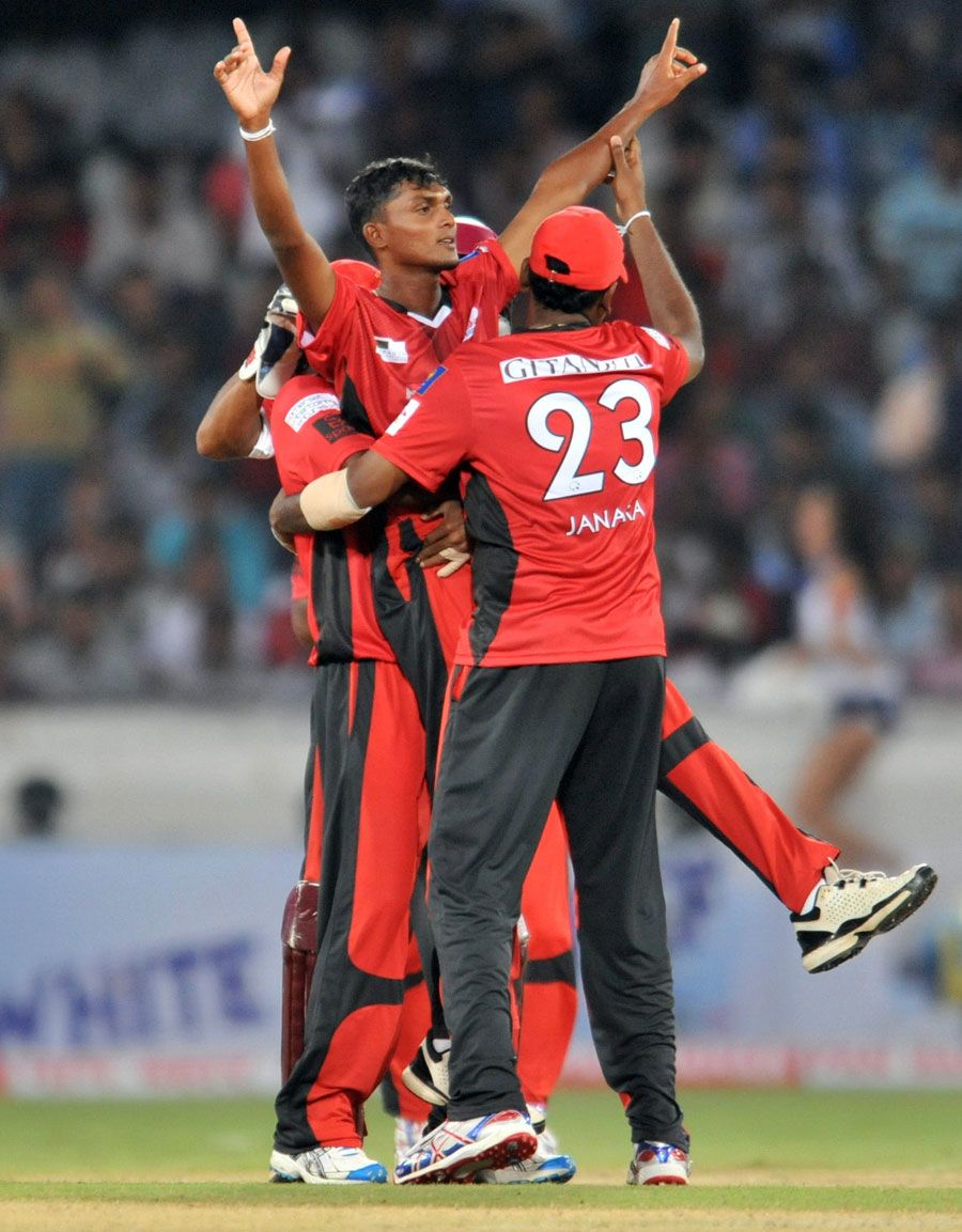 Alankara Asanka Silva raises his hands after removing Will Jefferson