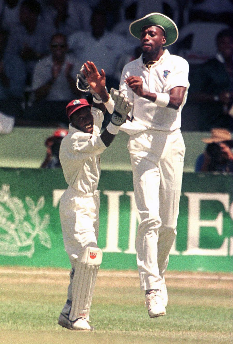David Williams and Curtly Ambrose celebrate a wicket