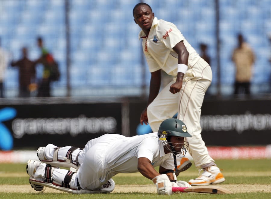 Raqibul Hasan dives to make his ground