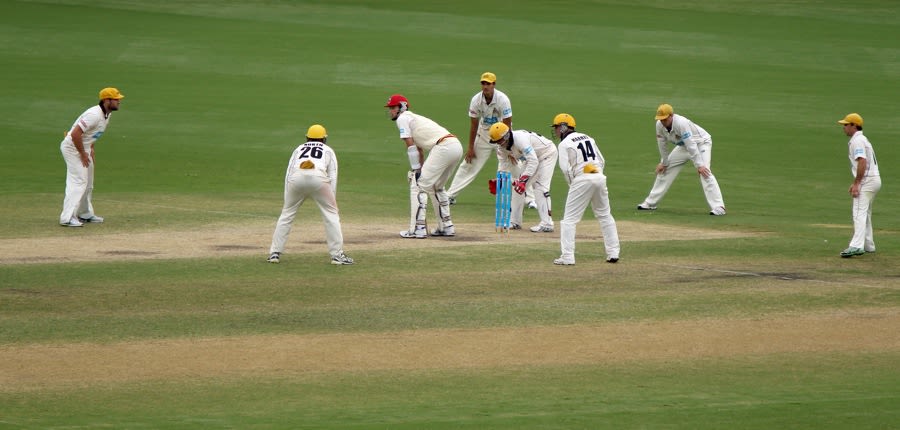 No. 11 Peter George surrounded by fielders