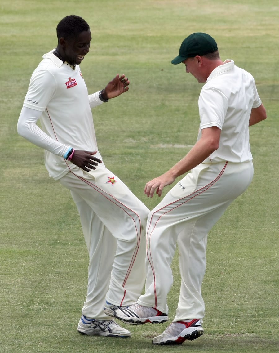 Chris Mpofu and Ray Price celebrate a wicket