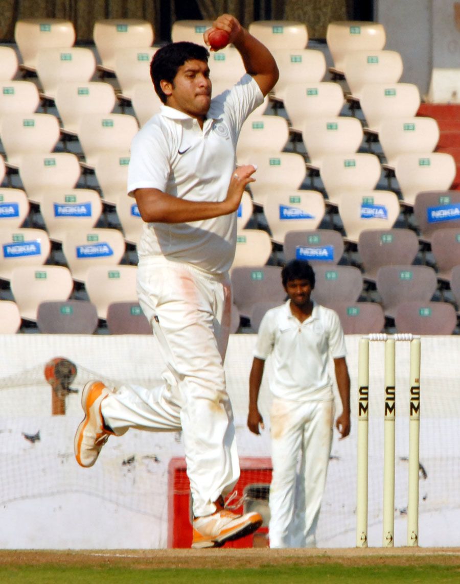 Mehdi Hasan runs up to the crease